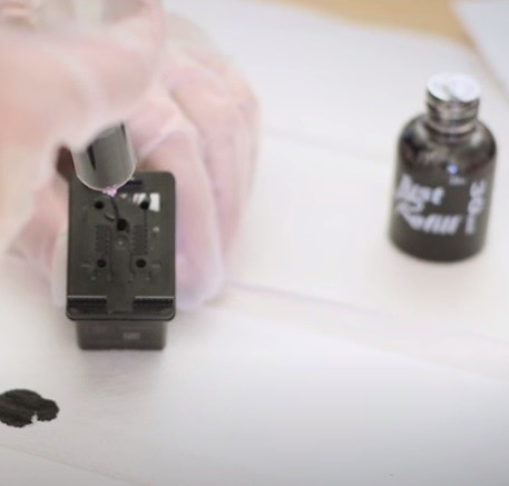 How To Refill Office Printer Cartridges: inject the ink into the cartridge using one of the refill ports